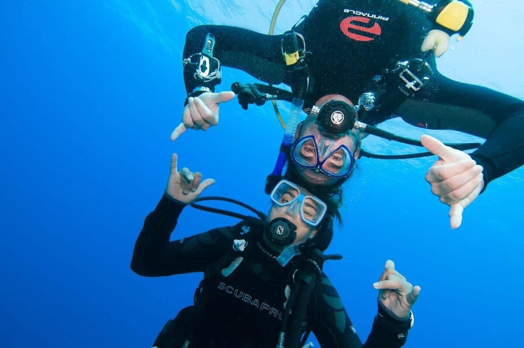 Divers in clear blue water