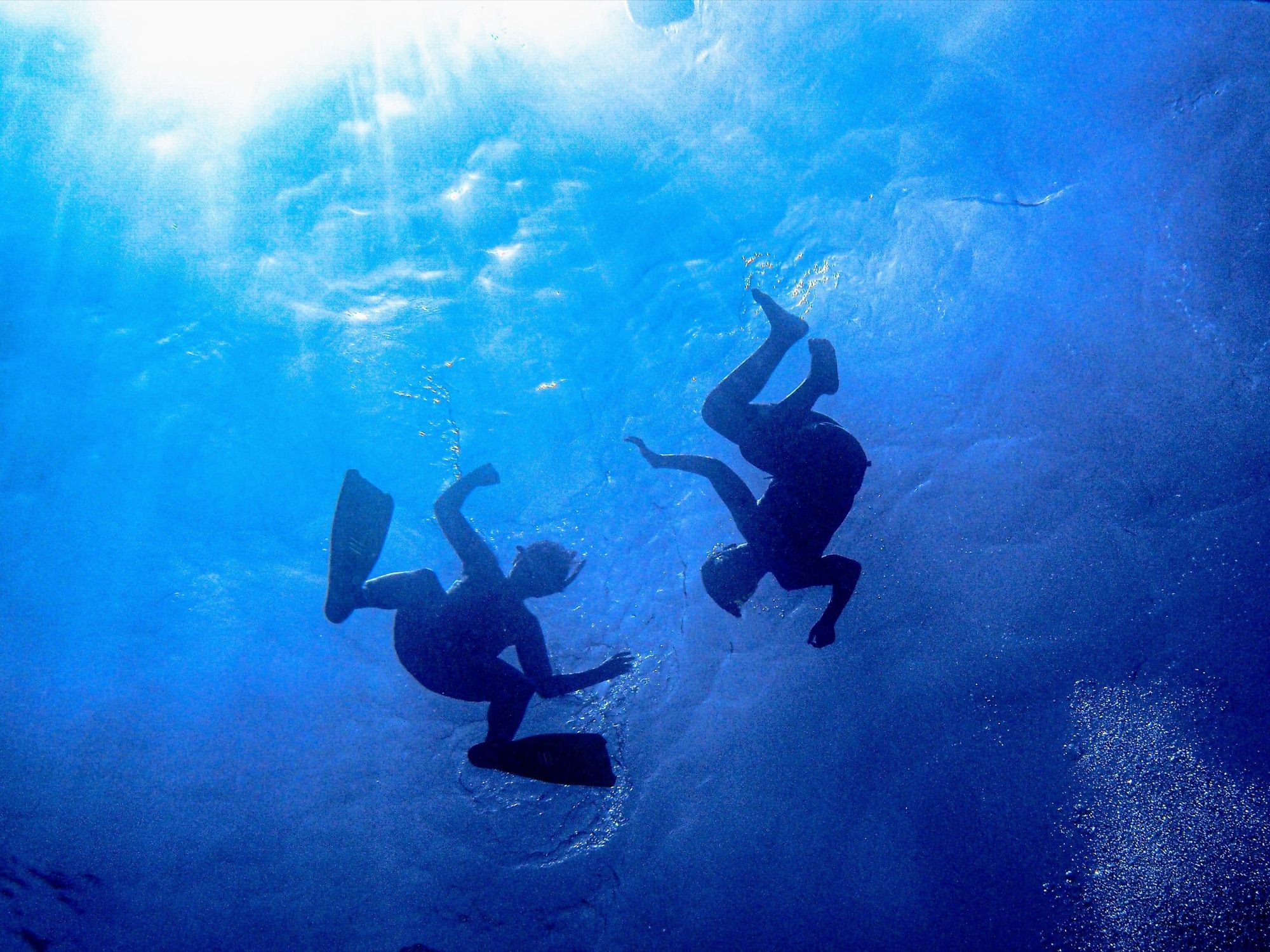 Divers descending in Maltese waters