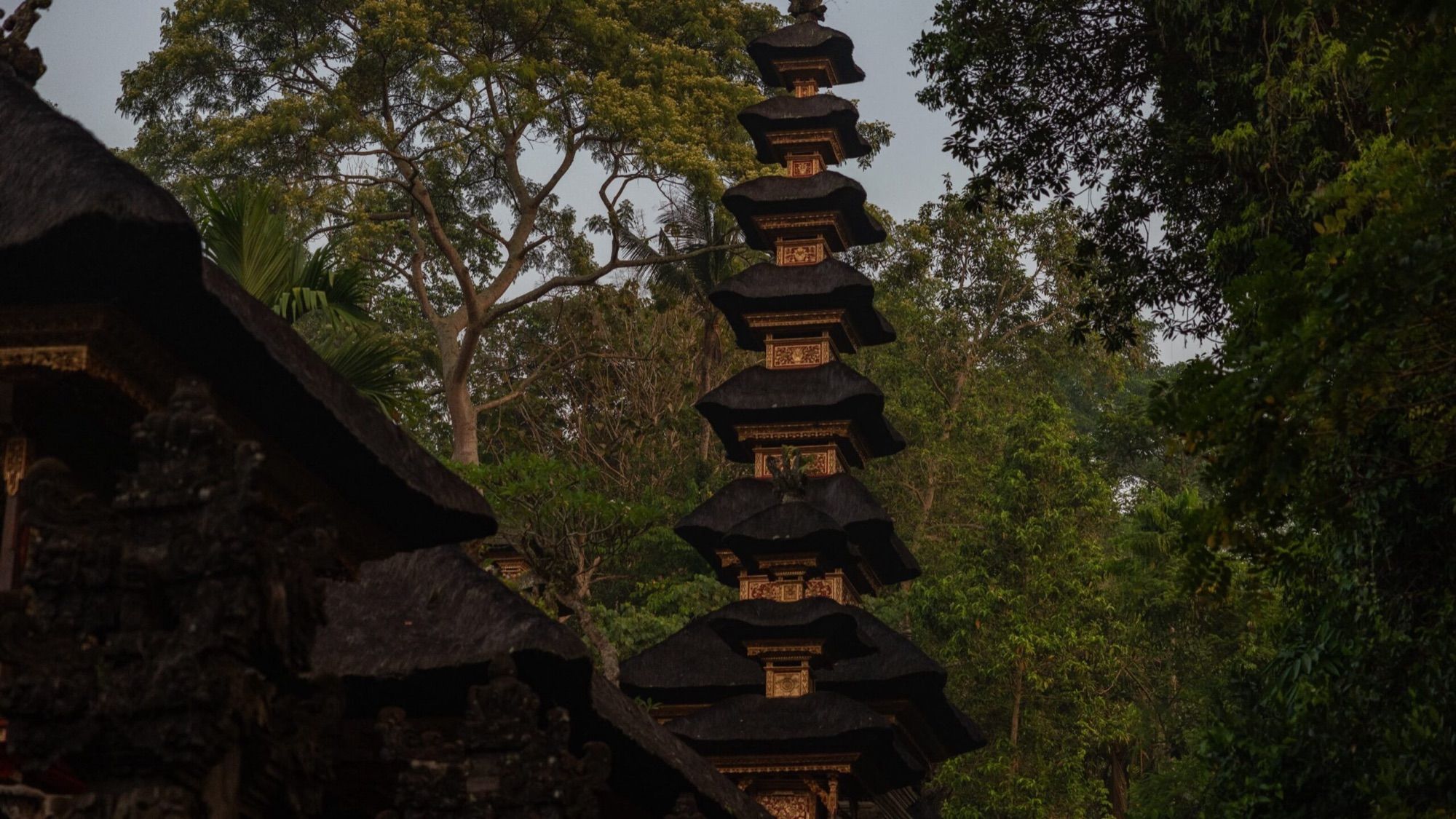 Balinese temple tower among the trees in Ubud