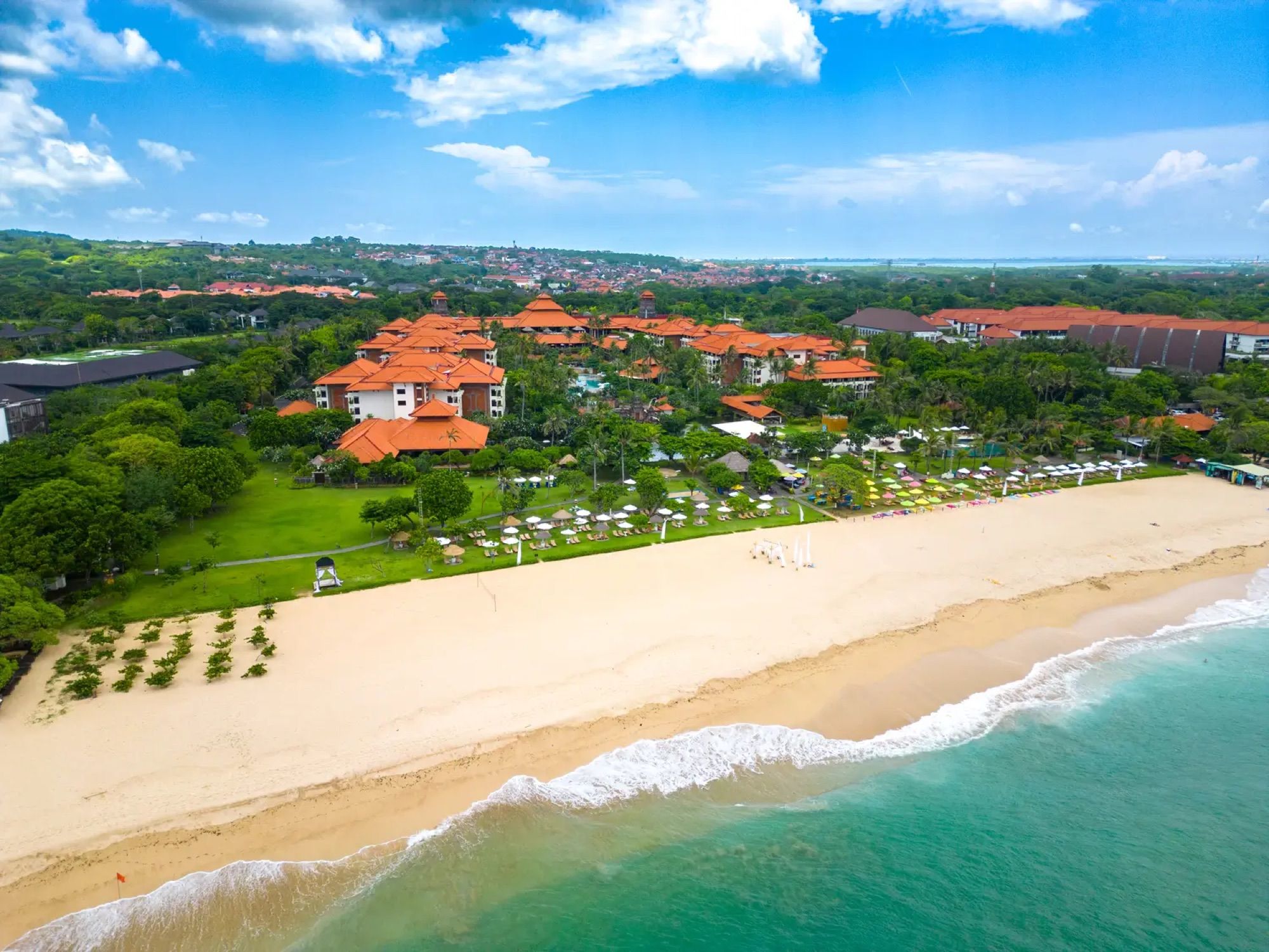 Mengiat Beach and the resort from the air