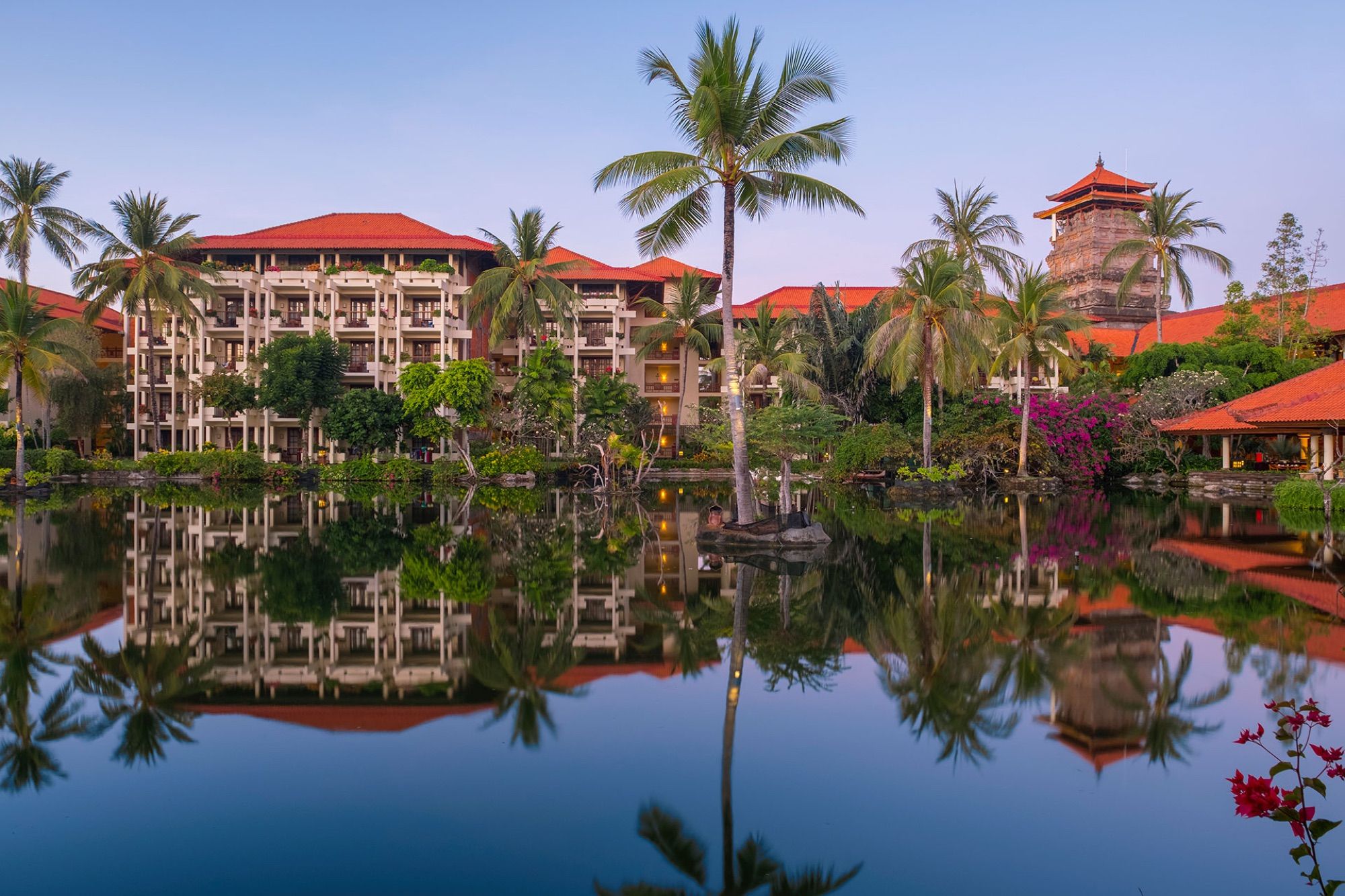 Resort buildings reflected in the lagoon