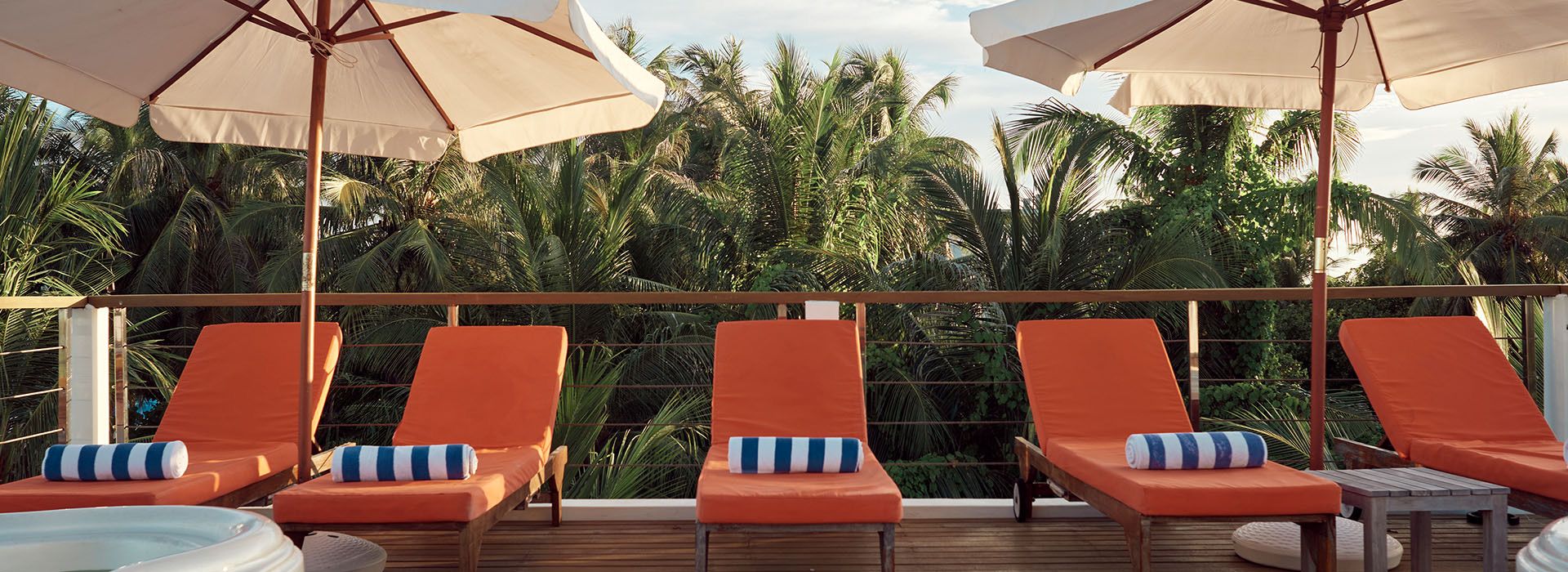 Rooftop terrace with loungers and parasols