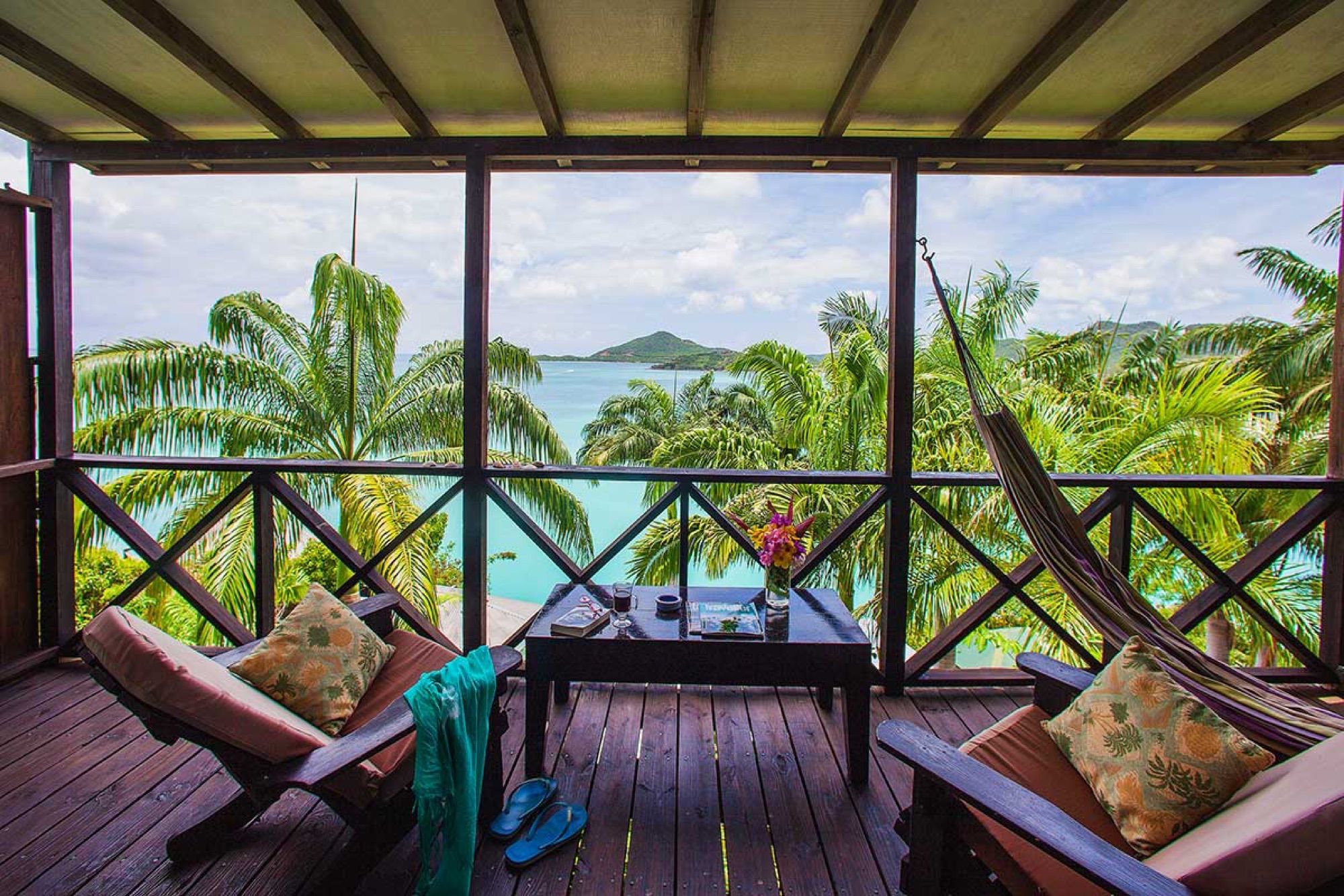 Cottage balcony with hammock and a view of the sea