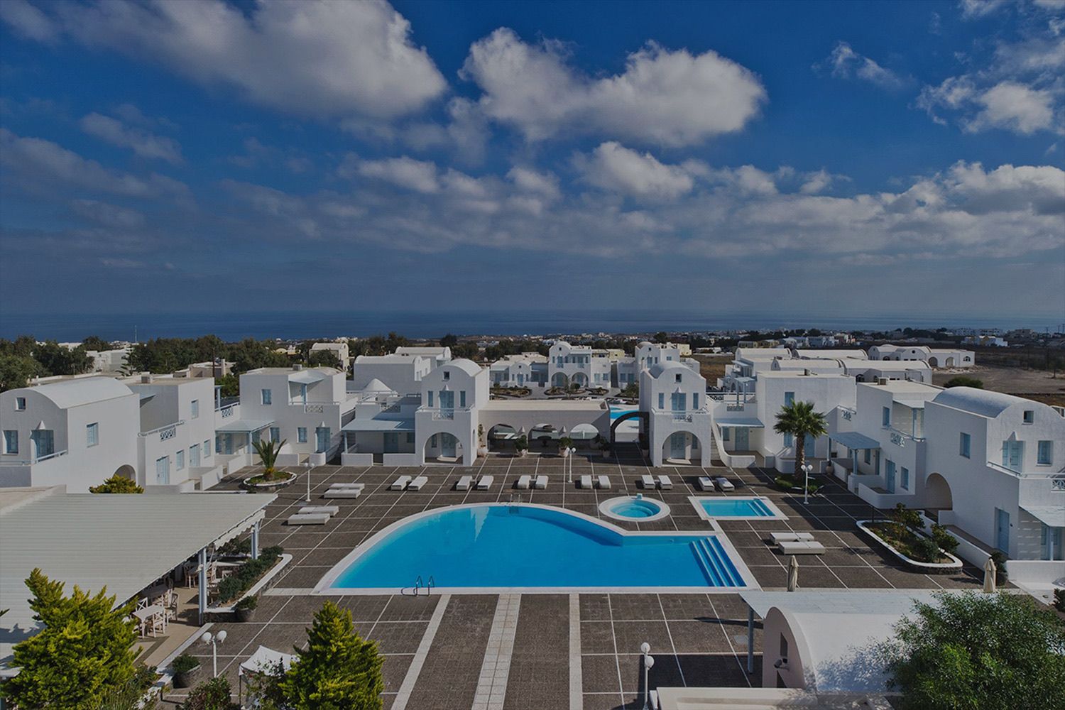 Pools and gardens of El Greco Resort from above