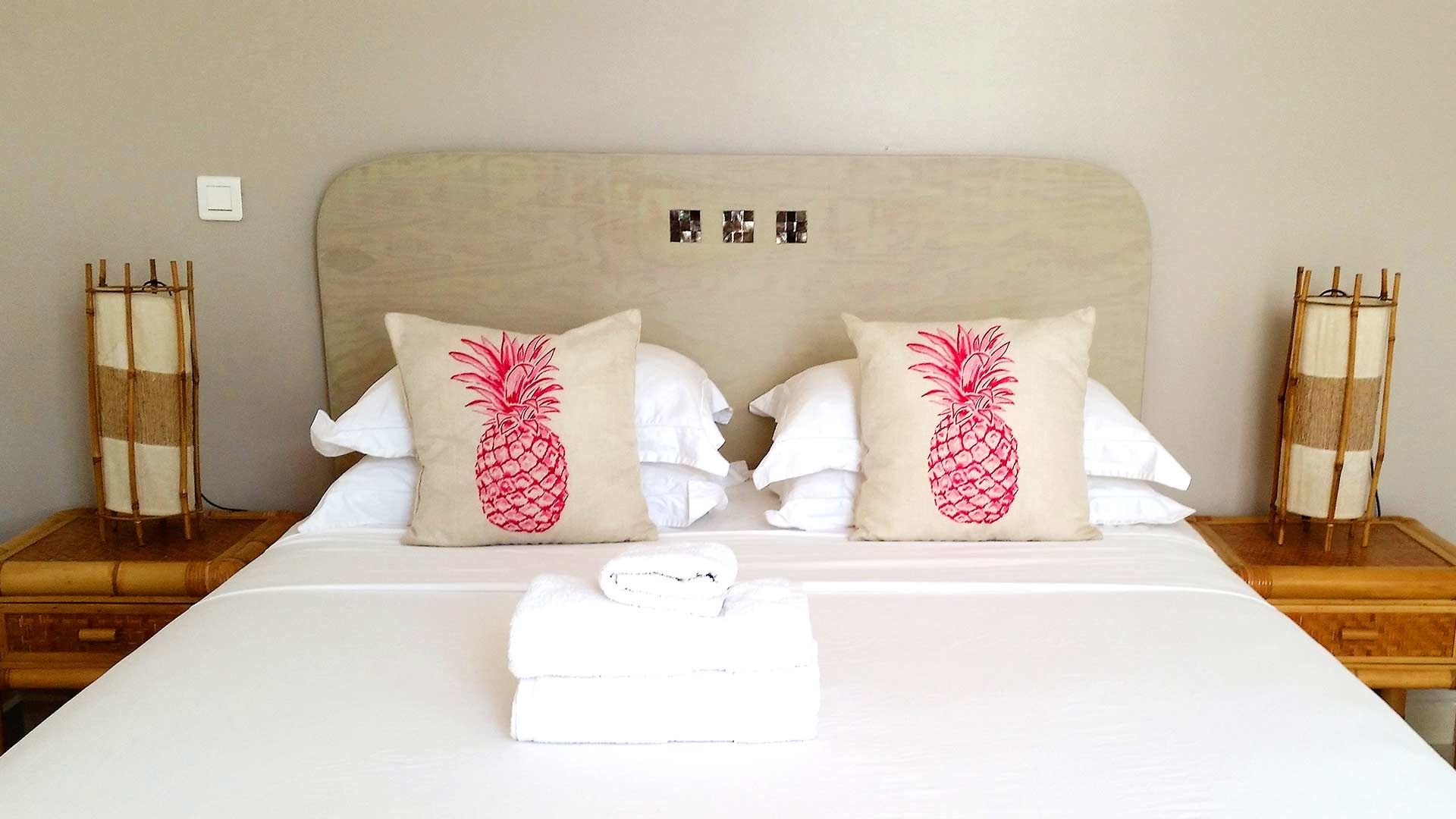 Double room with pineapple cushions