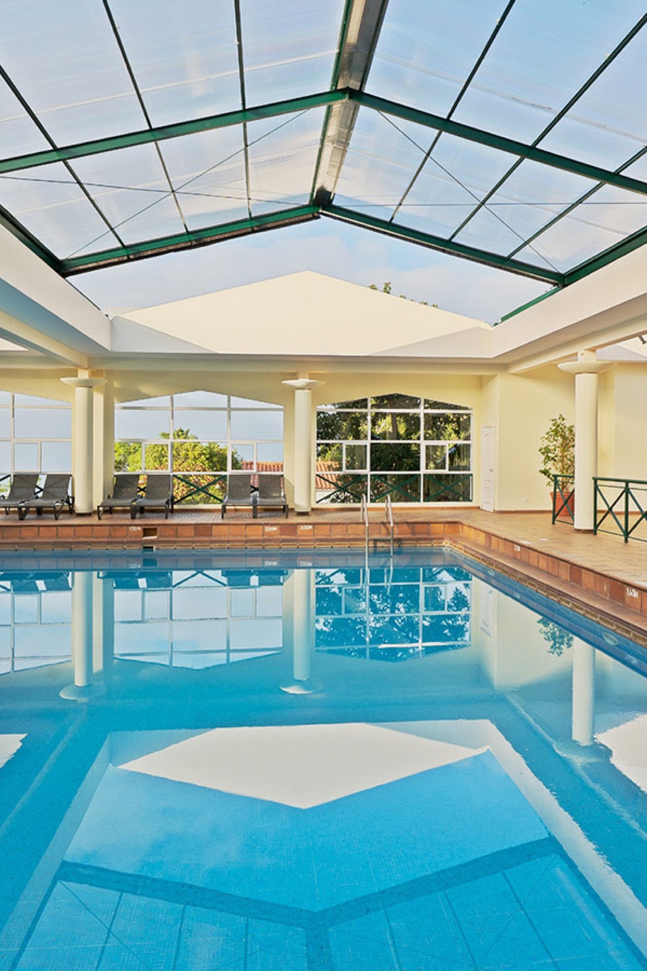 Heated indoor pool under a glass roof