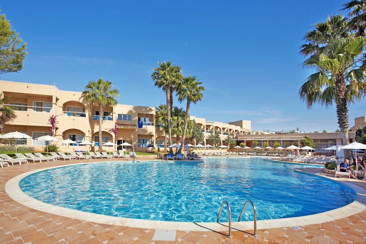 Round pool and sun loungers at Grupotel Santa Eulària & Spa