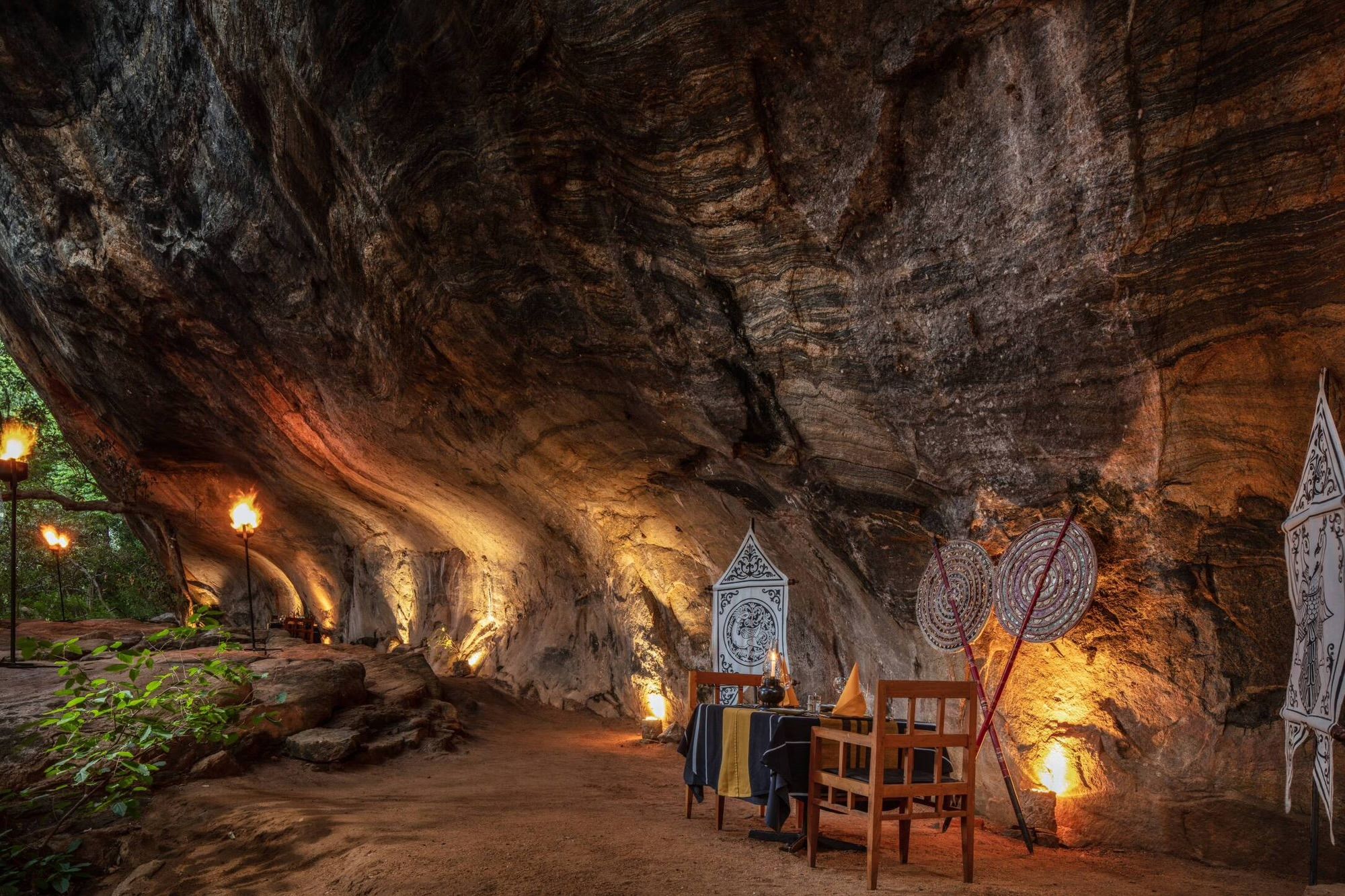 Candlelit dinner set in a rock cave