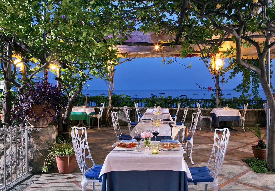 Restaurant terrace under the lemon trees at dusk