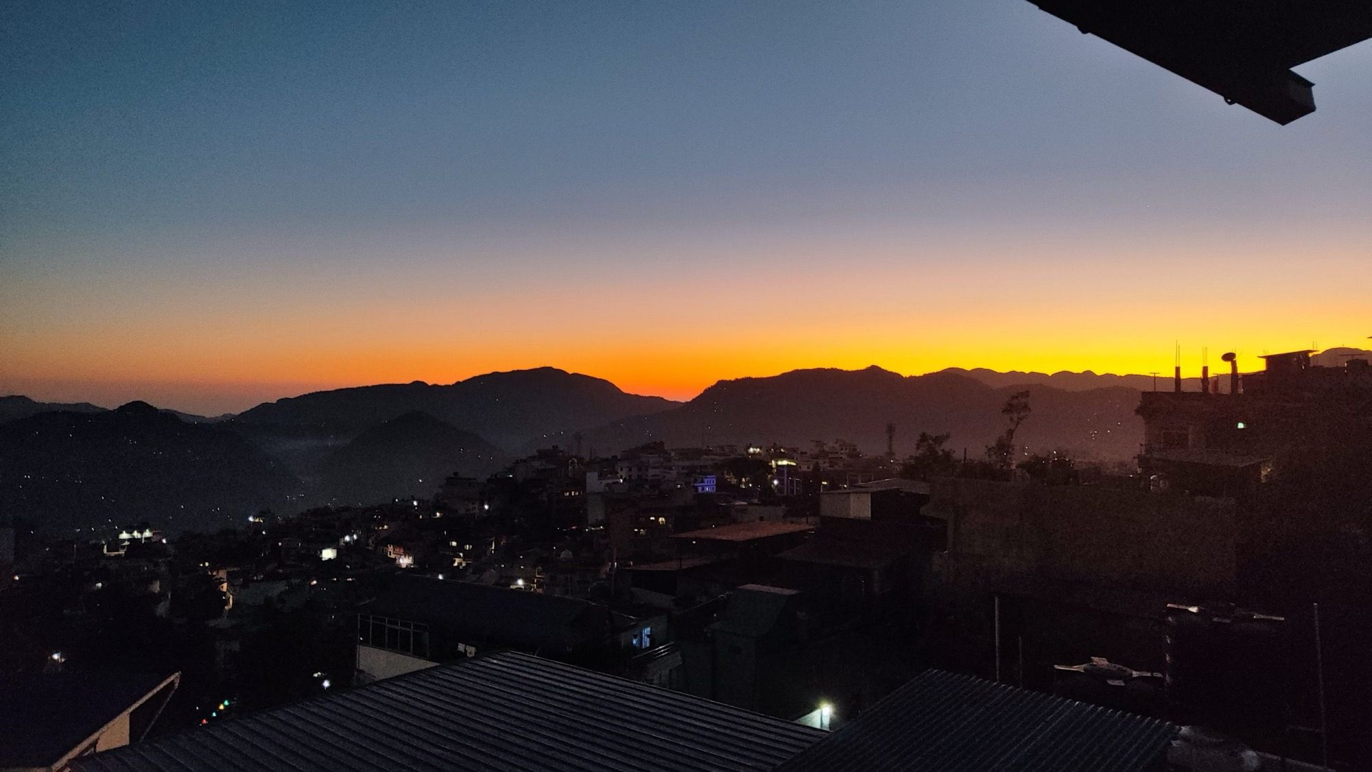 Sunset over the hills from the rooftop