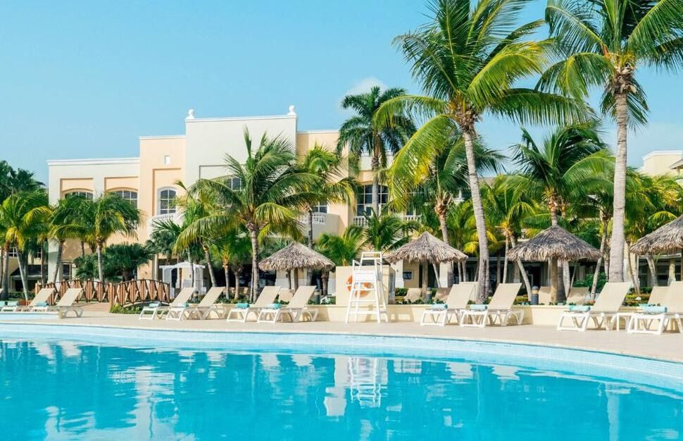 Pool with thatched sunshades