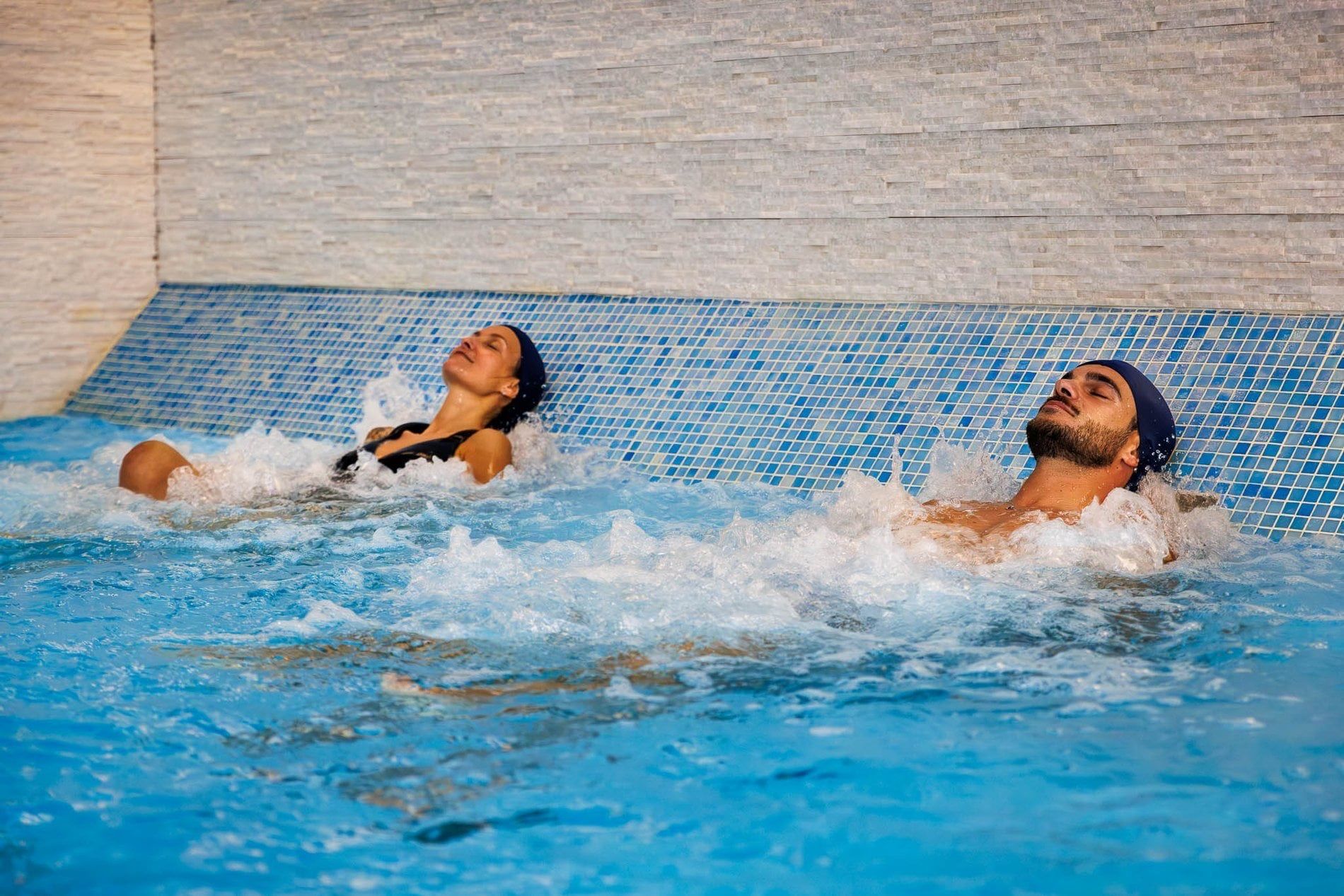 Couple relaxing in the hydromassage pool of the Soul Spa