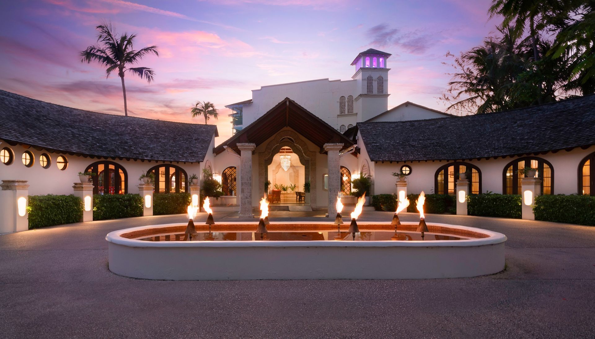 Mango Bay entrance courtyard at dusk
