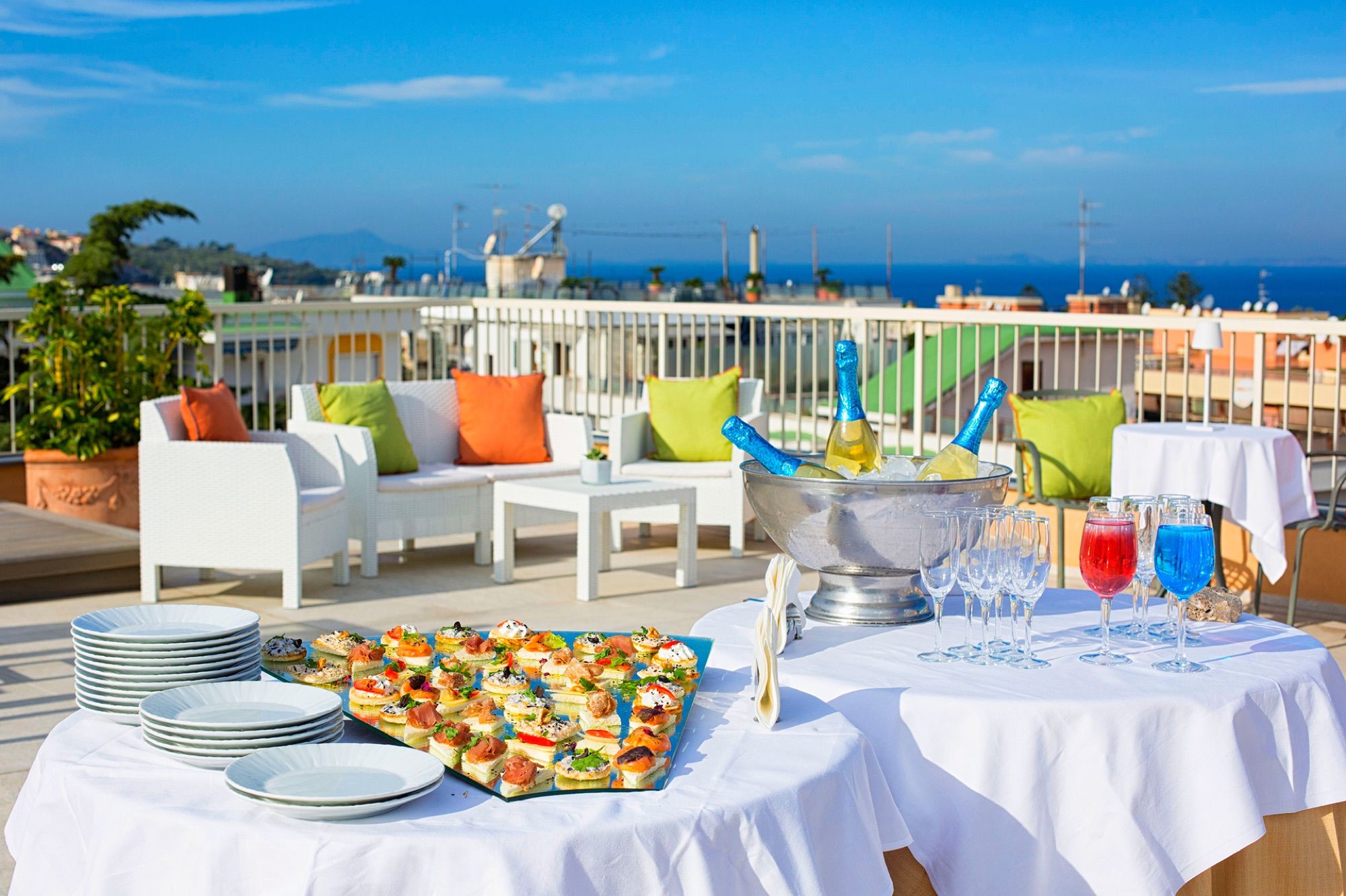 Roof terrace set for aperitivo with sea view