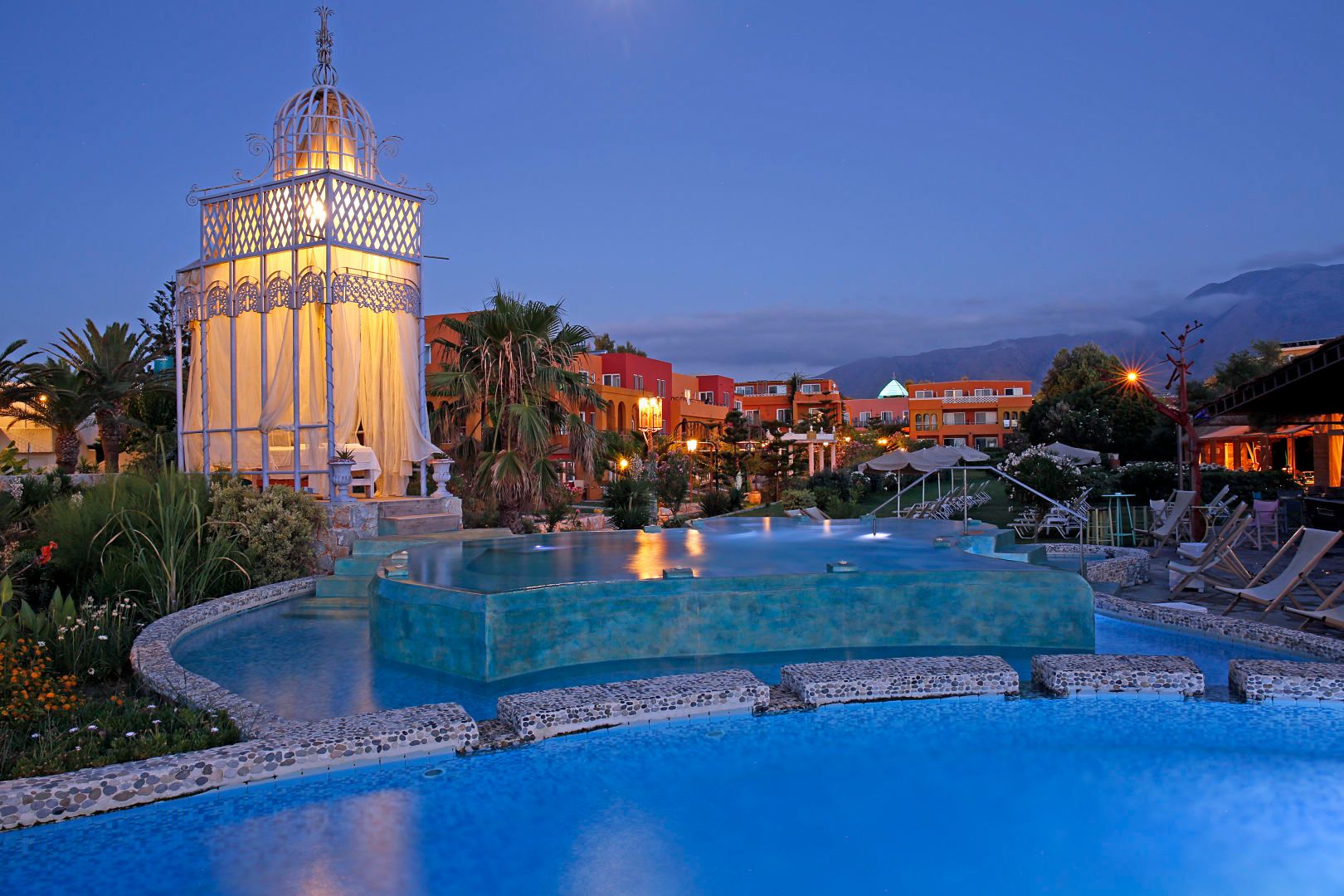 The pool at dusk with the White Mountains behind