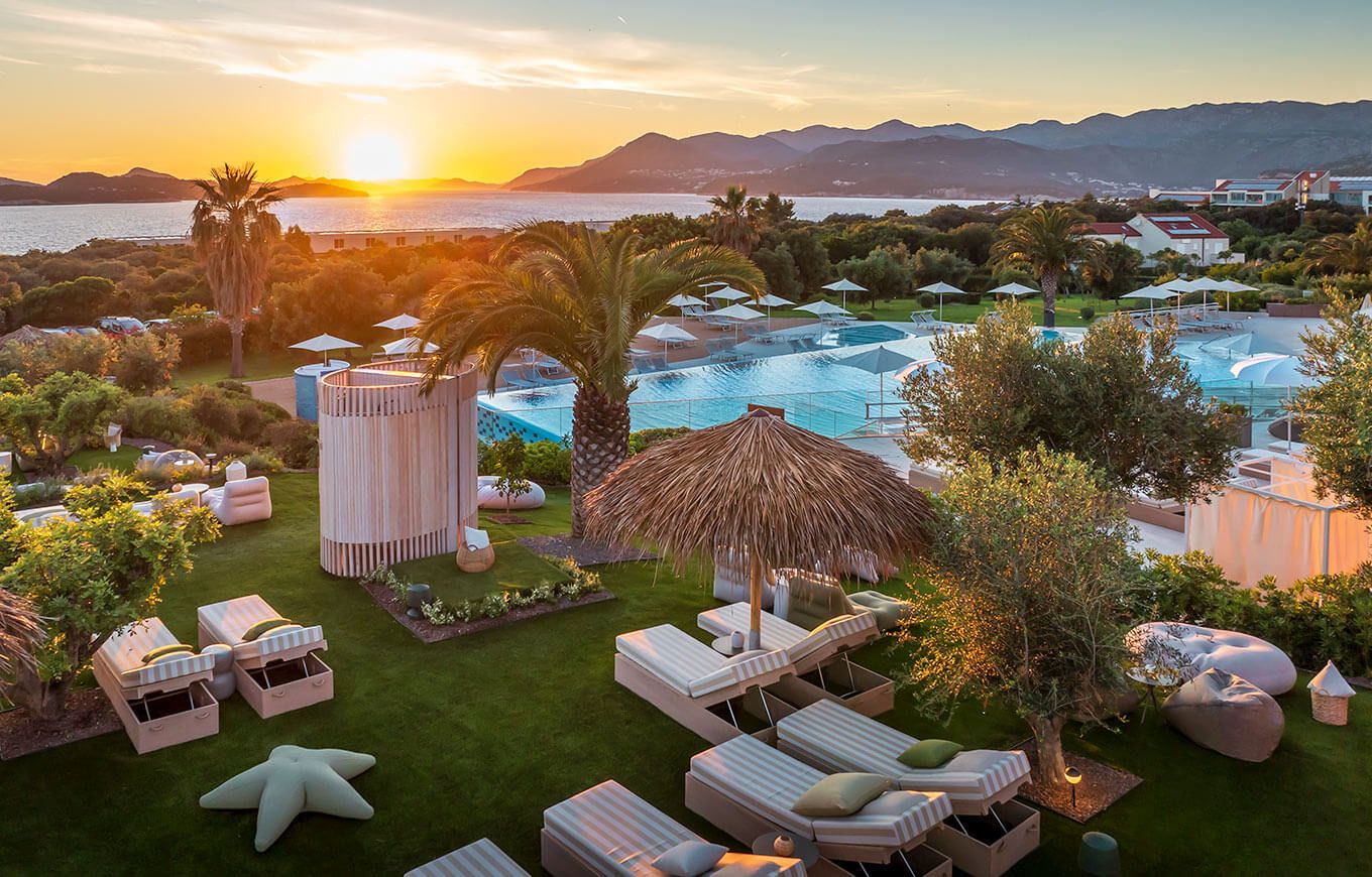 Outdoor spa garden and pools at sunset