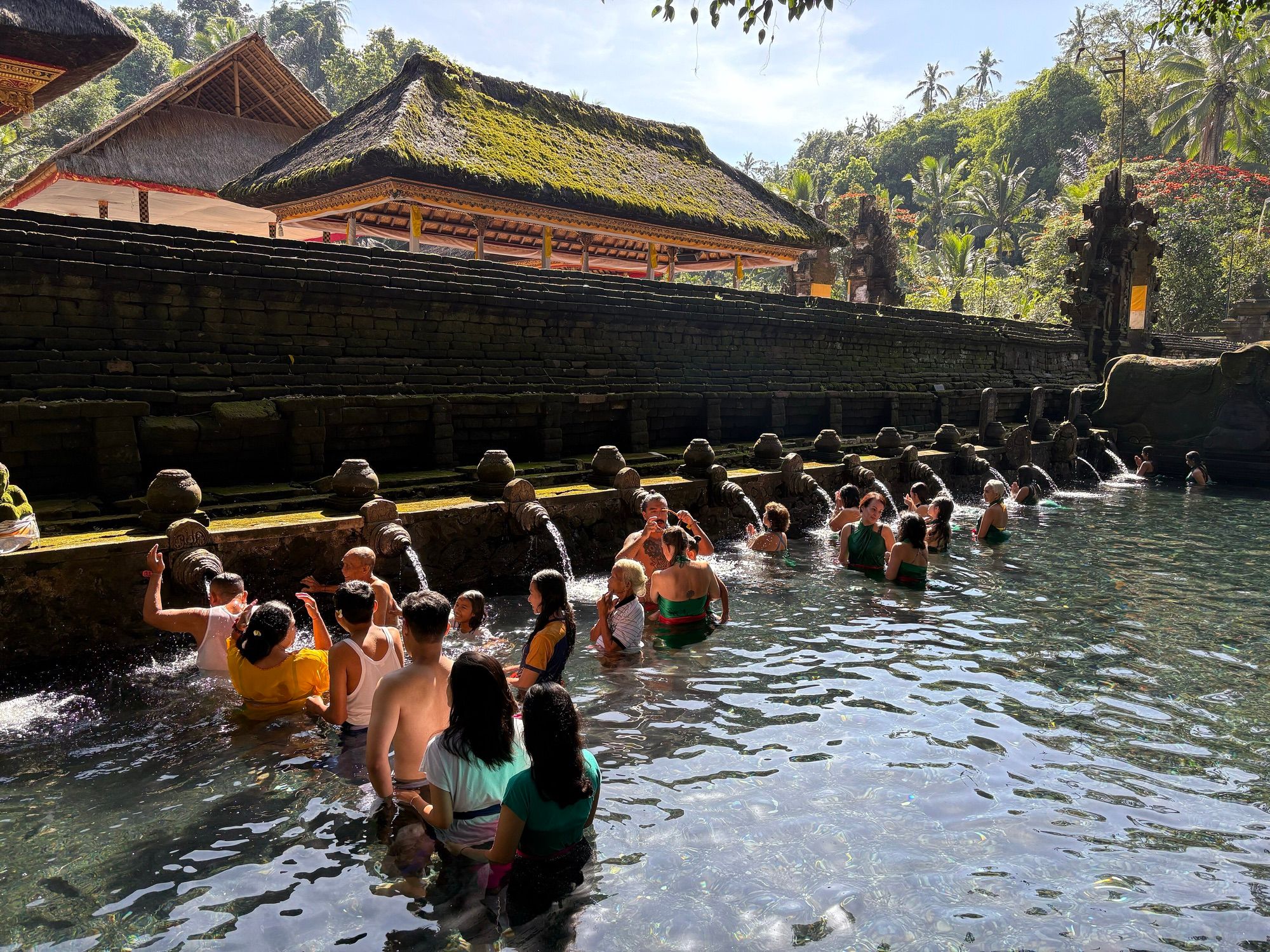 Bathers at the holy spring pools of Tirta Empul