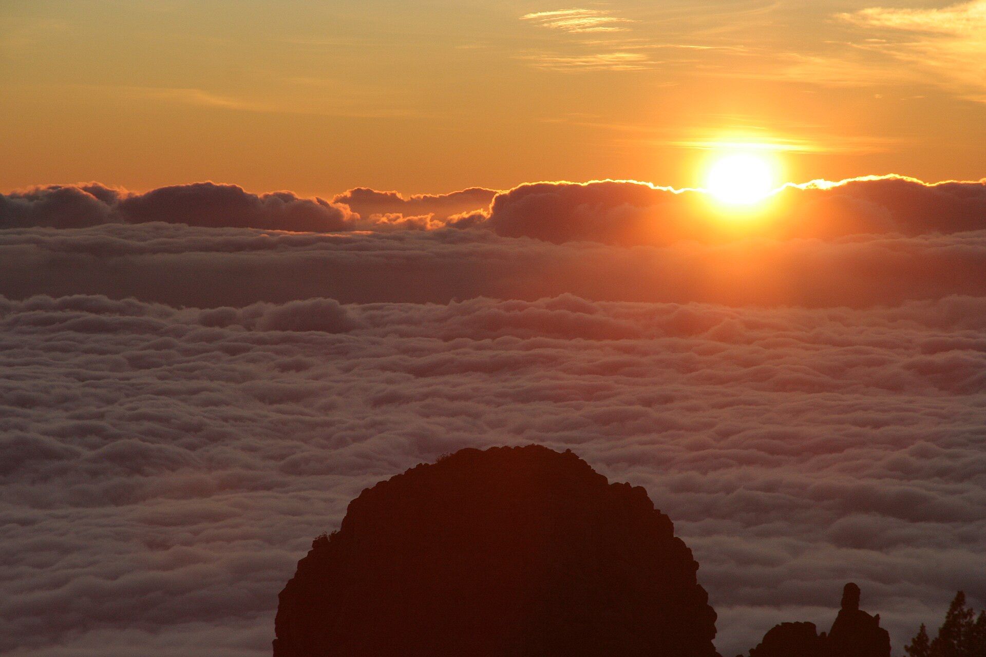 Sun setting above the clouds from Teide National Park