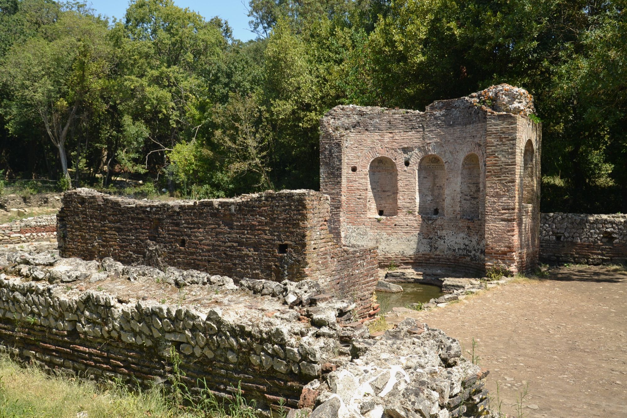 Roman-era ruins among the trees at Butrint